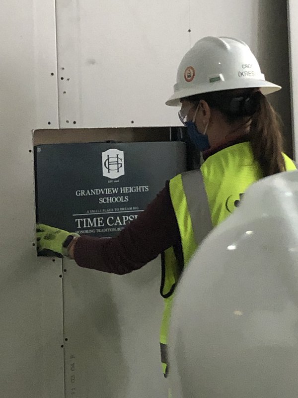 timeCorna Kokosing Project Engineer Colleen Cross places the time capsule into the new front lobby wall..jpg