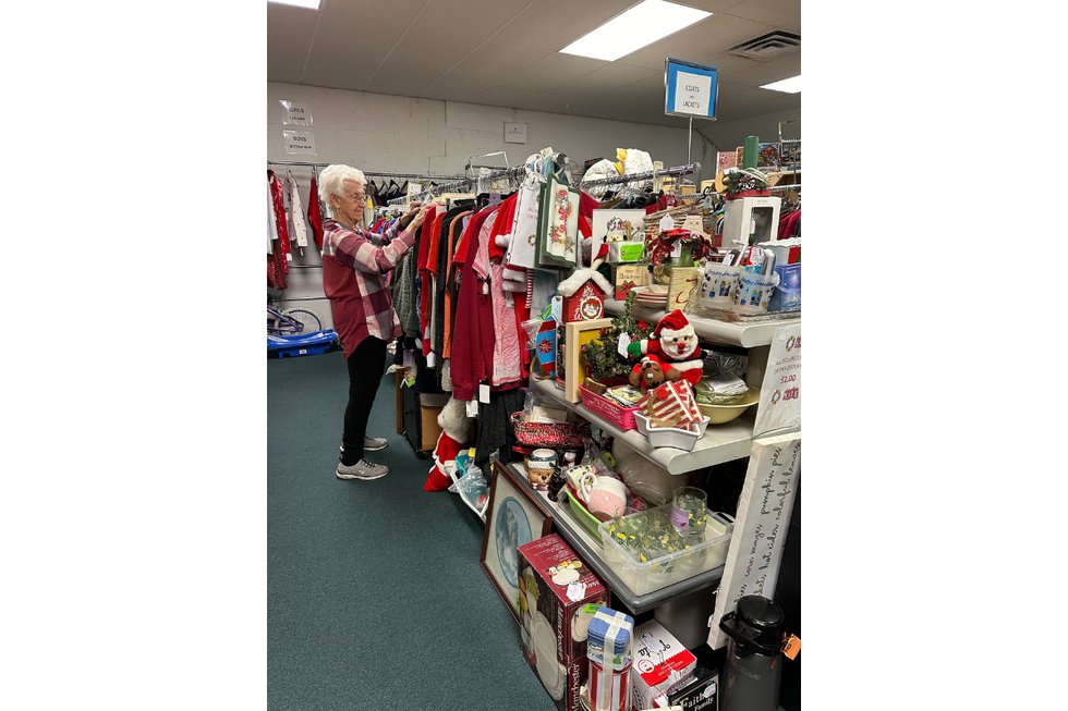 Volunteer Sally Adkins preparing the store