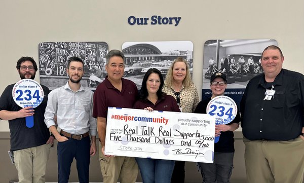 MeijerDonation_Board Director Mitch Curry and Founders Chris and Sheri Dunagan accept a donation from Grove City Meijer..jpg